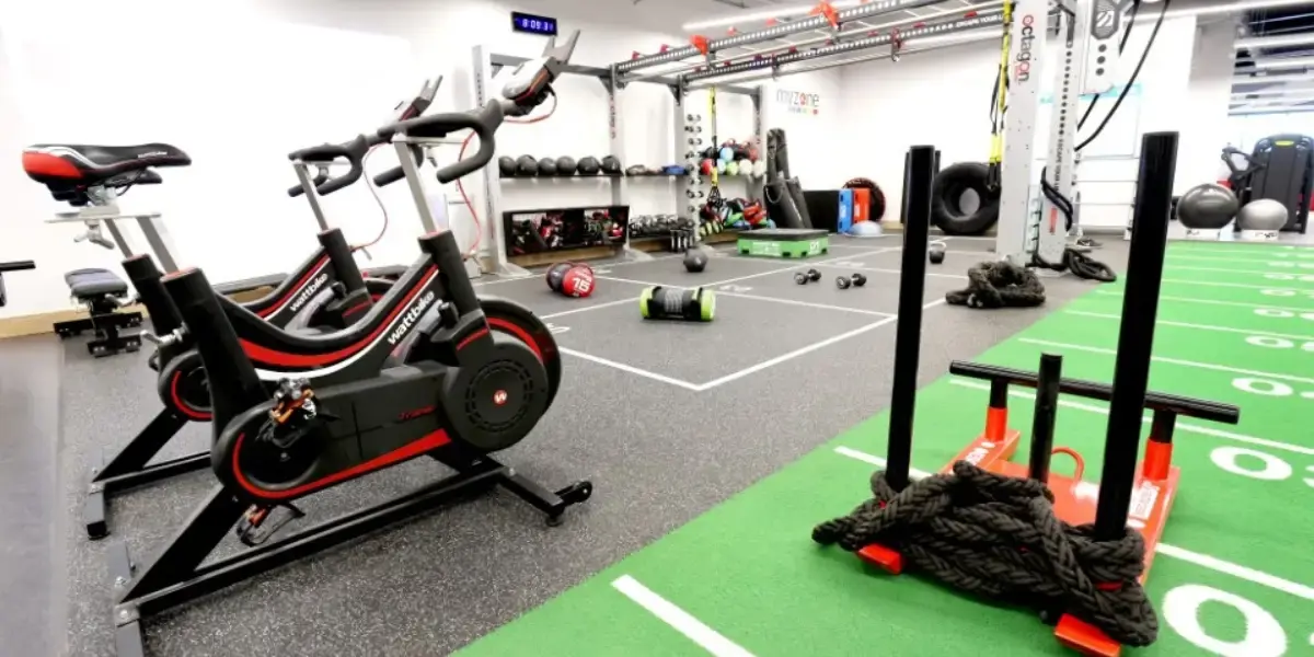 Spin bikes and weight sled in gym